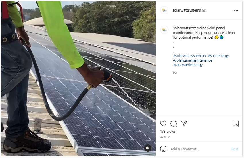 Solar Power - Maintaining Solar Panels - Screenshot from Instagram of a man hosing down a solar array
