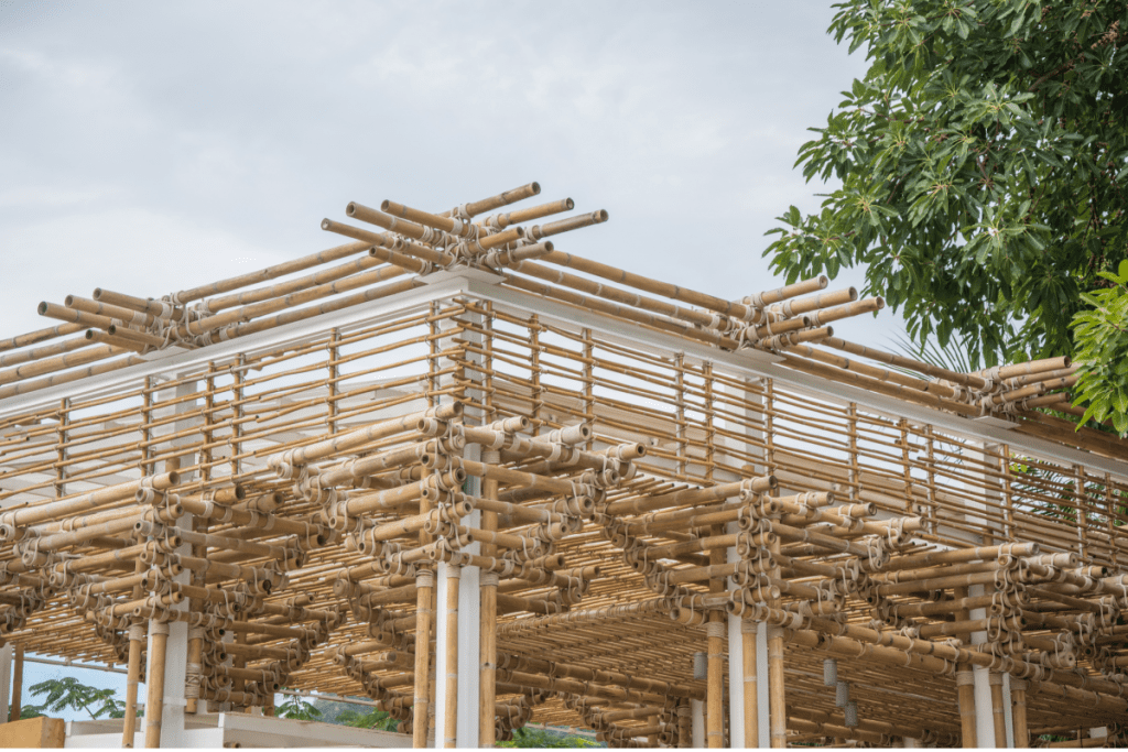 Image from Canva.com of a complex building under construction using eco-friendly bamboo