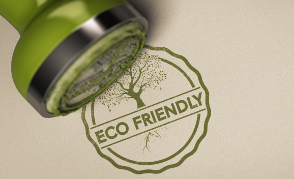 Sustainability certifications - free image from canva of a stamp and the stamped words "eco-friendly" in green ink.