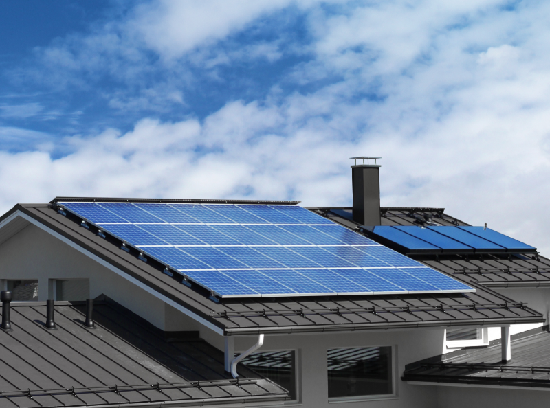 self-sufficient homes: image of solar panels on a residential building roof