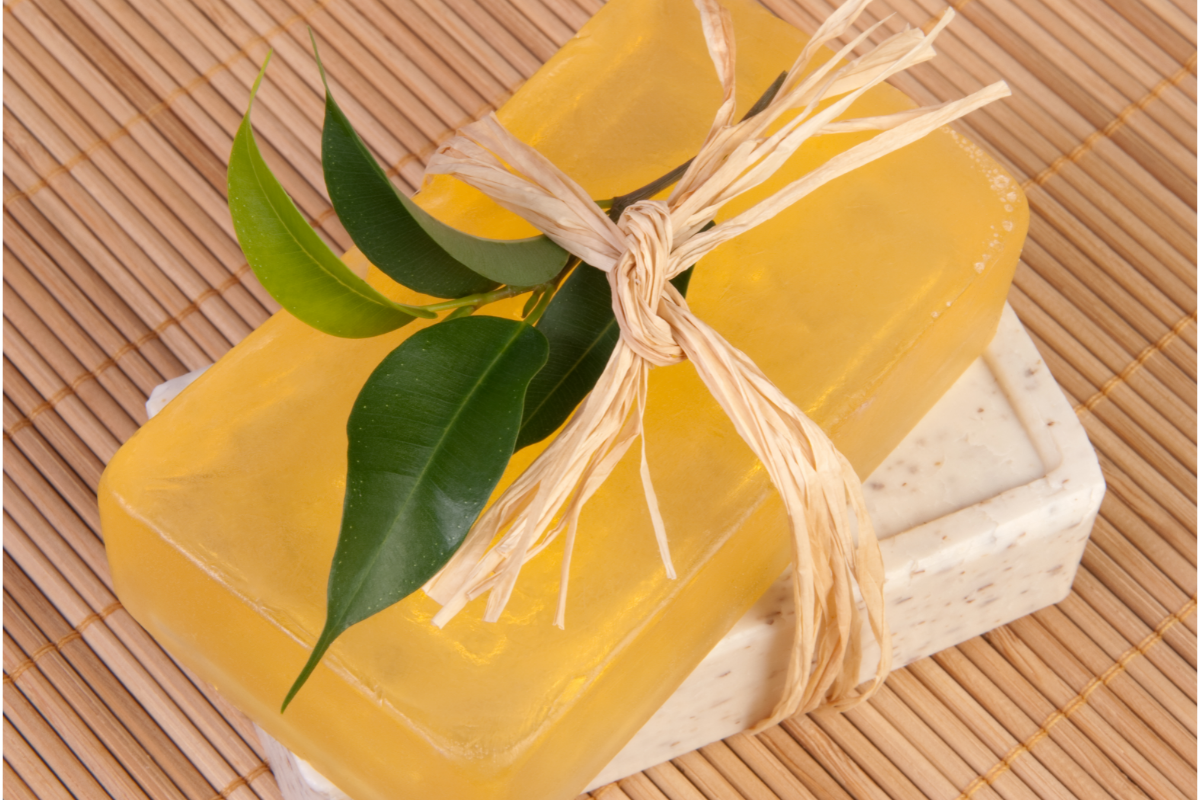 Eco friendly Soap - Stock image from Canva of two bars of soap with a green leaf tied to them with raffia string