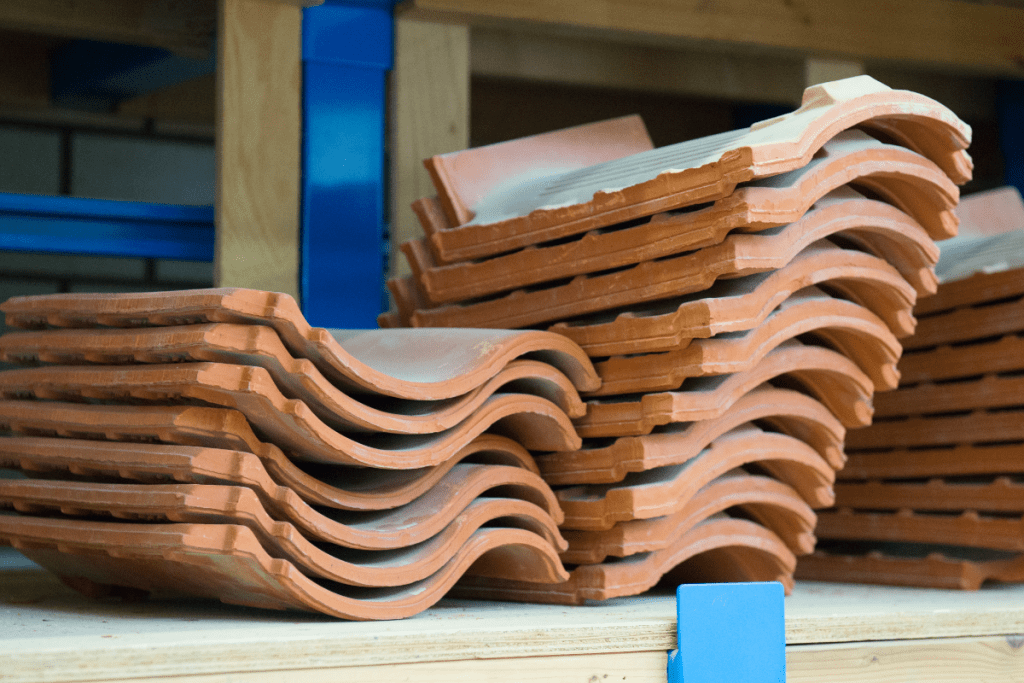 Storing building materials - small stack of roof tiles on a wooden shelf