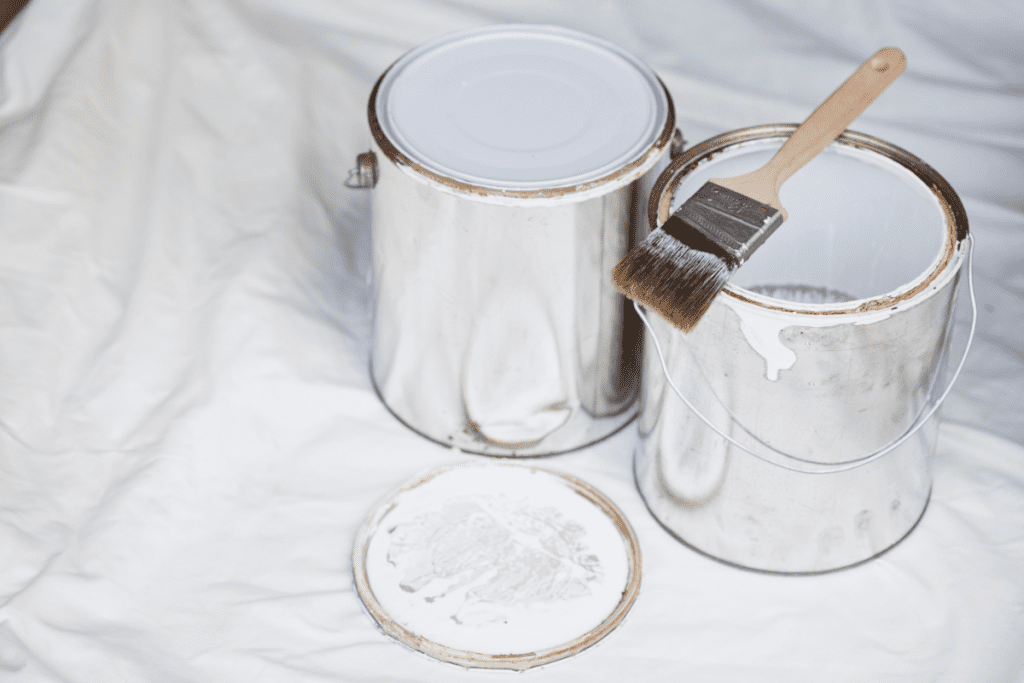 Storing building materials - used paint tins with the lids on