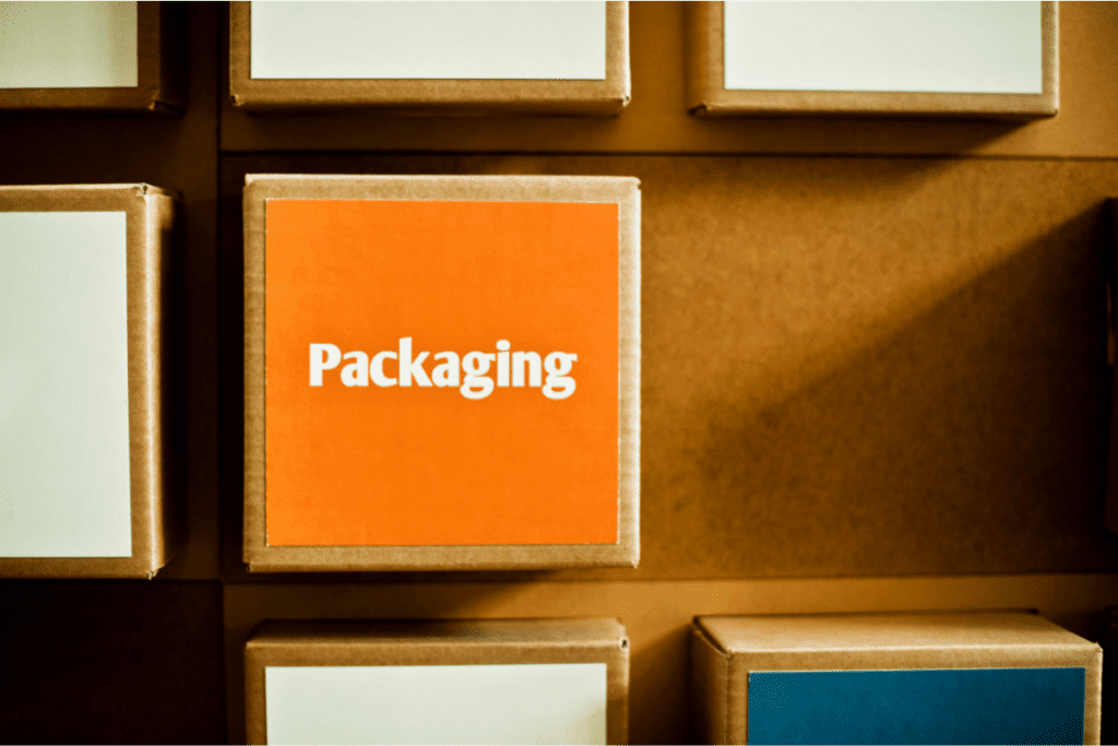 Square cubes of branded cardboard packaging with different colors on them