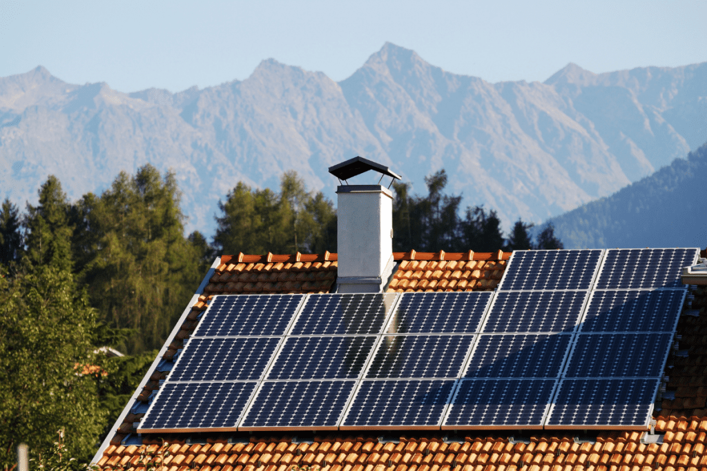 Eco-friendly lighting - Image of a house roof with solar panels on it