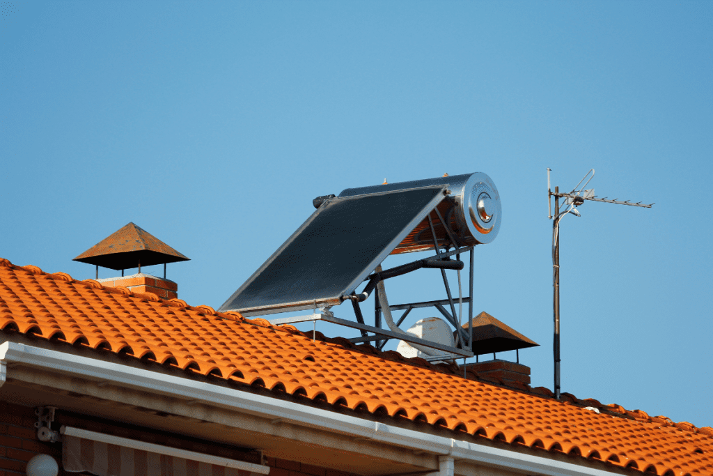 Environmentally friendly heating - solar water heating system on the roof of a house