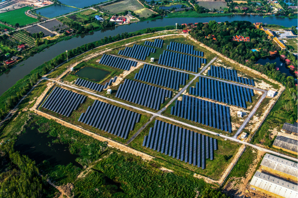 Facts About Solar Energy - Arial view of a Solar Farm with large banks of solar panels in a grid pattern