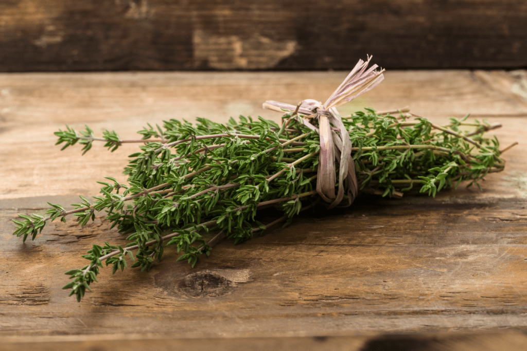 Bundle of Thyme on a wooden cutting board