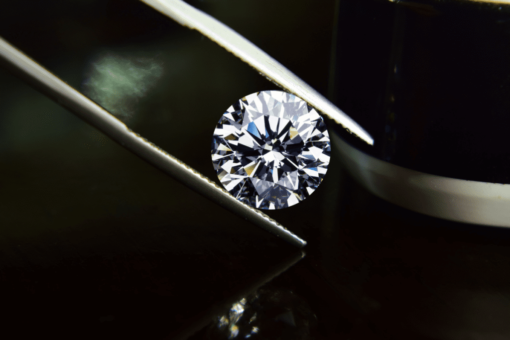 Lab-grown Diamonds - stock image of a diamond held by foreceps