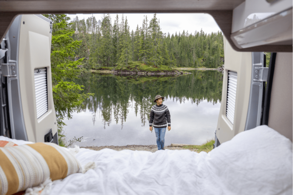 Van Life on the edge of a lake - stock image from Canva