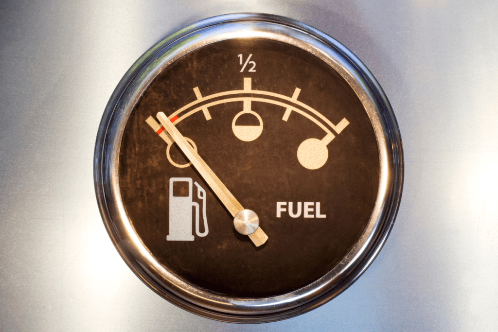 How to Improve Your Fuel Economy - Stock Image from Canva of a vintage car's fuel clock pointing to empty