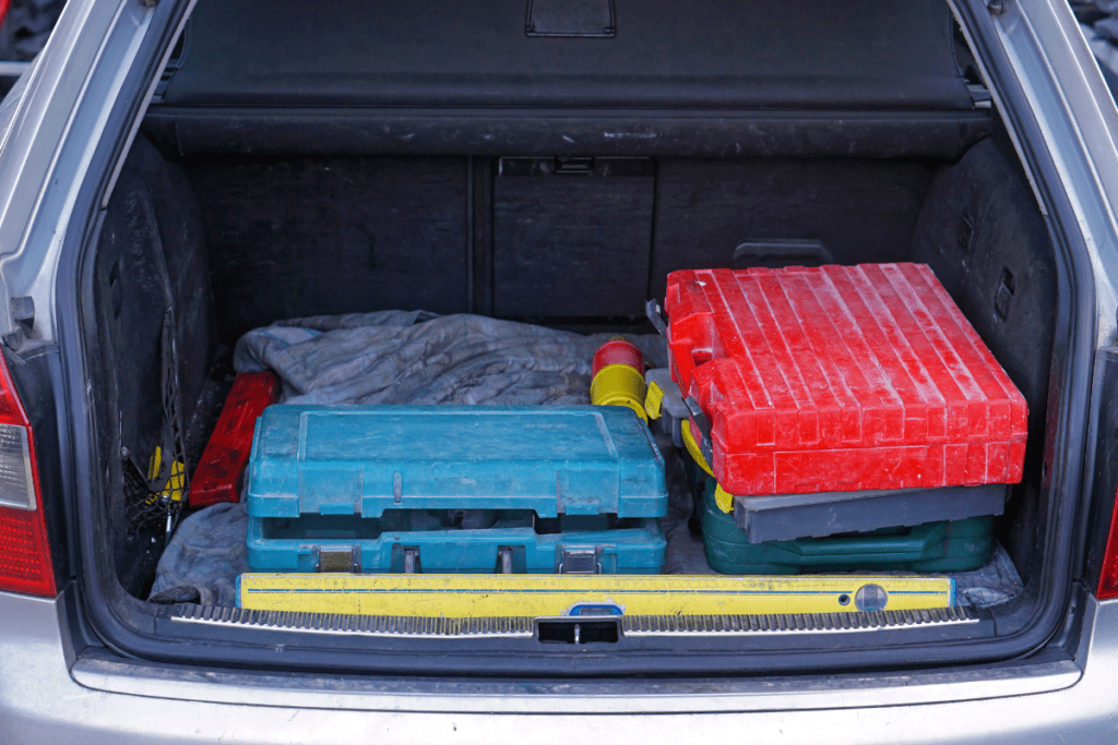 How to Improve Your Fuel Economy - Stock Image from Canva of the trunk of a car filled with tools and boxes