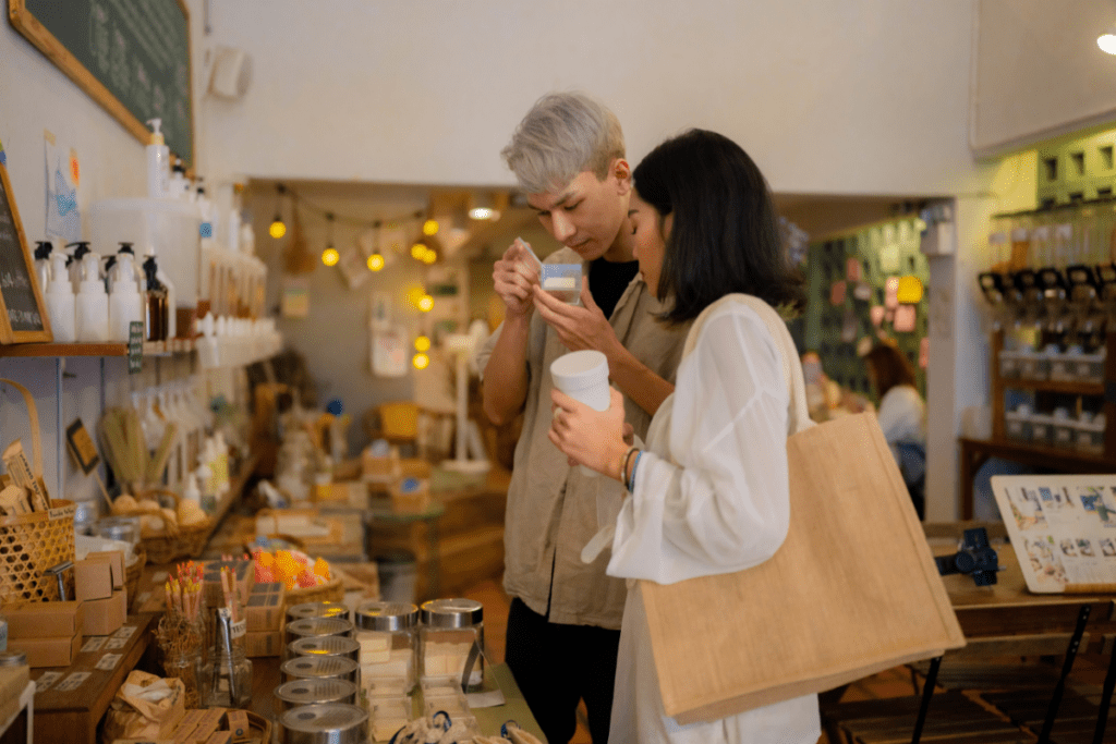 eco-friendly vacation - stock image from, canva of a two people trying products in a small boutique-style shop