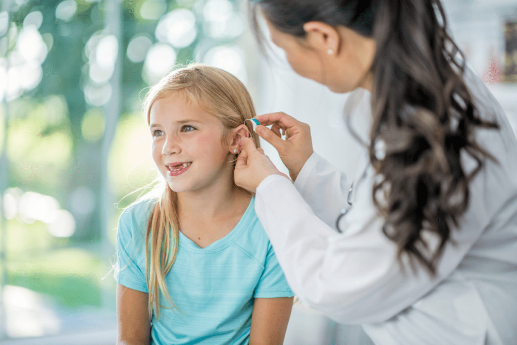 Little girl being fitted for hearing aids