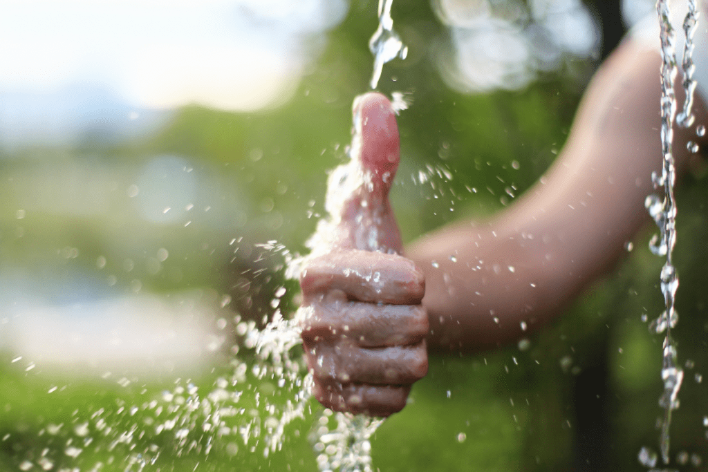 Plant based lifestyle and water conservation: Image of a hand/thumbs up gesture