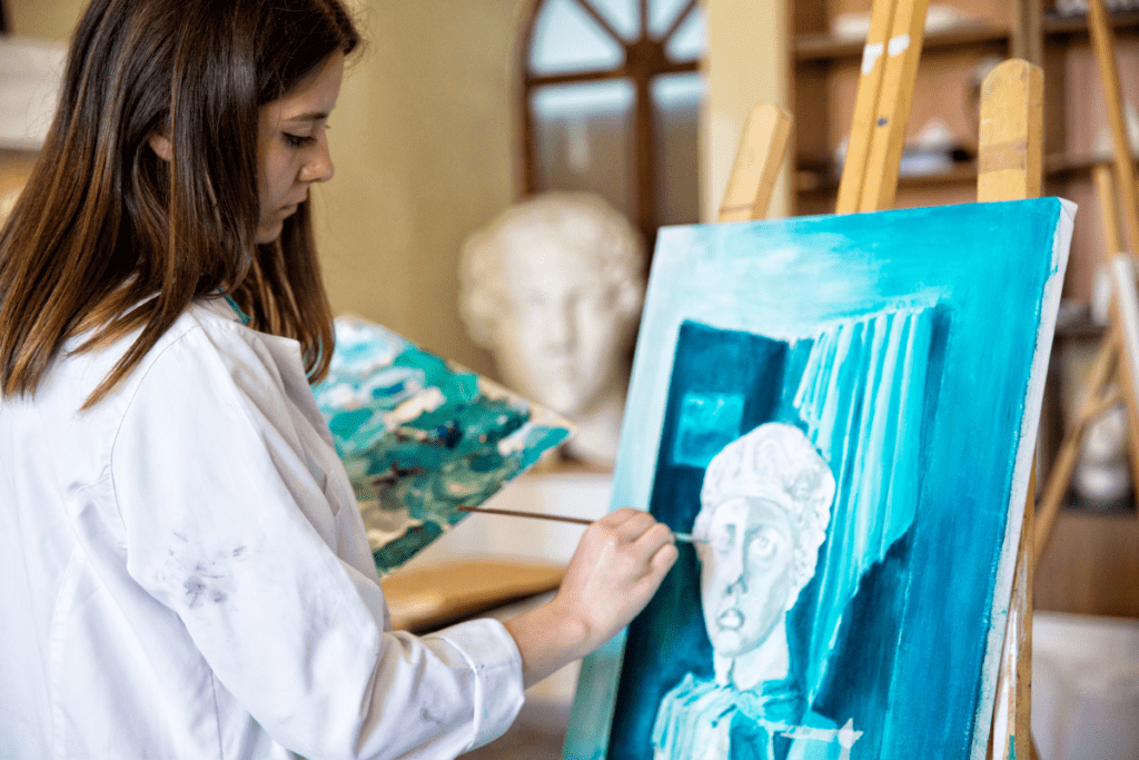Eco-friendly Painting Practices - artist painting on an easel 