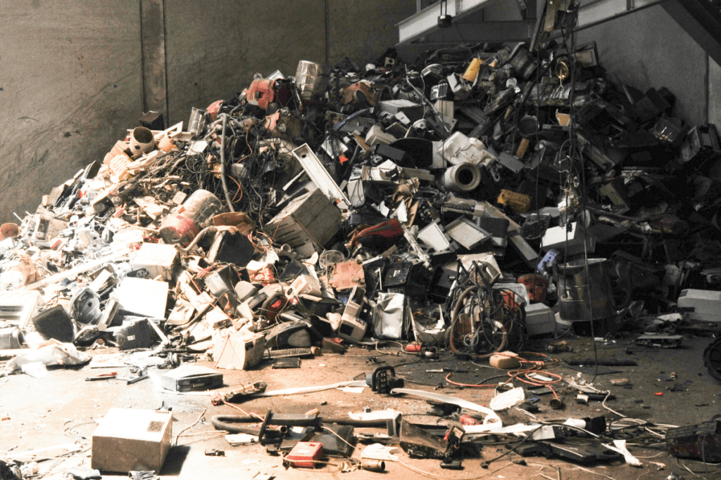 How to Reduce E-Waste - Pile of discarded electronics