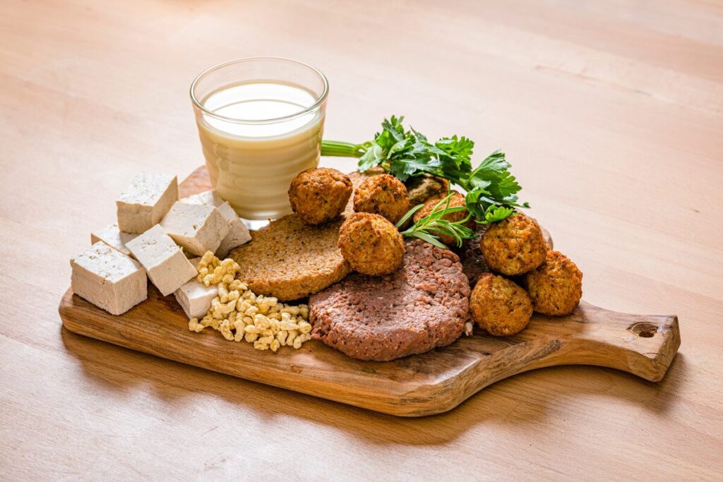 Vegan foods that are high in protein: tofu, falafel balls, vegan burger patties and nut milk