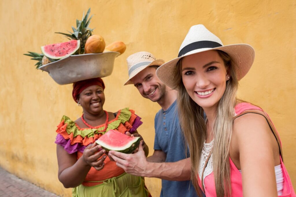 tourists buying fruits in local vendor