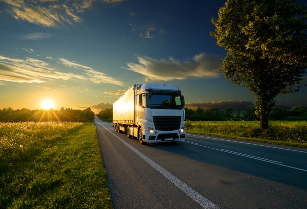 truck in a green landscape - green supply chain feature image