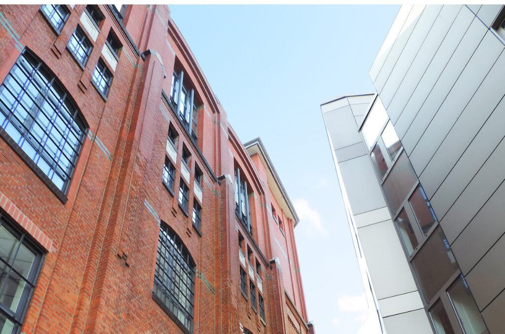 adaptive reuse in buildings - old and modern building standing together